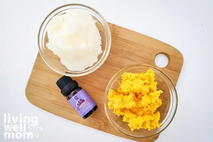 Ingredients for DIY body lotion including shea butter, coconut oil and lavender essential oil. 