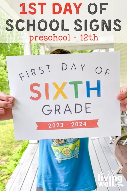 boy with blue shirt holding rainbow colored paper that says first day of sixth grade 2023-2024 