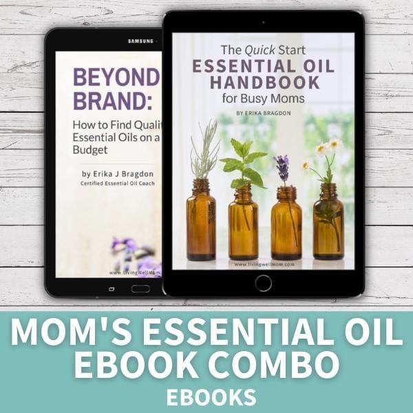tablets with essential oil handbook and beyond the brand ebooks on white wood background