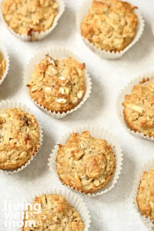 baked apple oatmeal breakfast muffins in white paper muffin cups