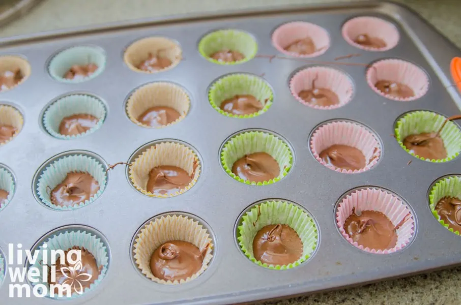 melted chocolate in lined muffin pan