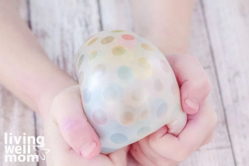 kid playing with homemade stress ball