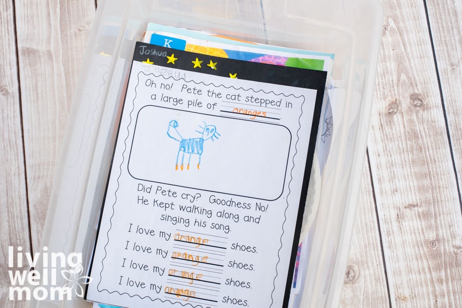 stacks of student worksheets in a plastic bin