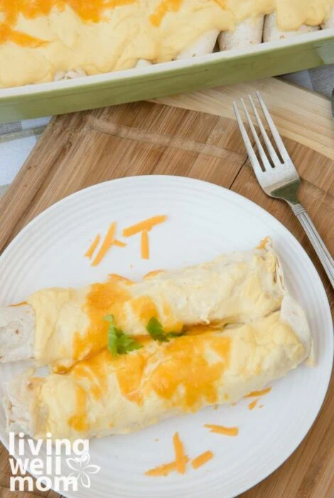 two white chicken enchiladas on a plate