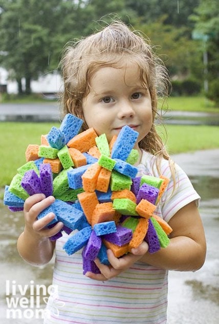 girl holding homemade water bombs made from sponges