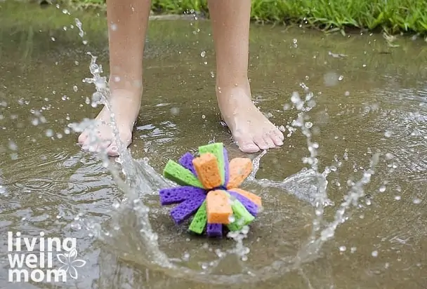 kids feet splashing in water next to a DIY water ball