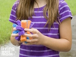 holding a sponge water toy