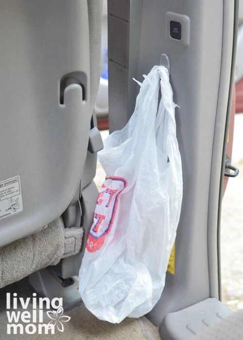 plastic bag on a command hook in backseat