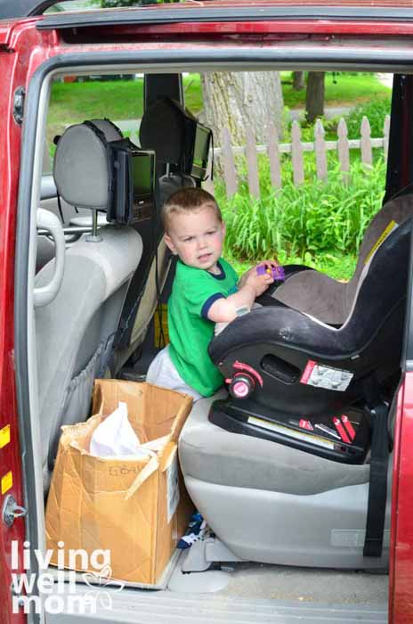 kid in back seat of van