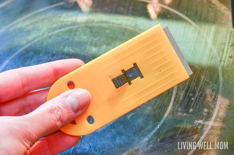 Razor blade that cleans a glass stove top.