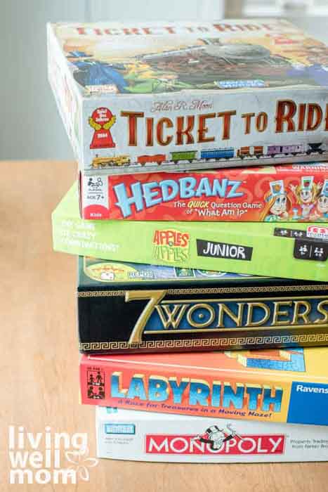 board games in a stack for family game night