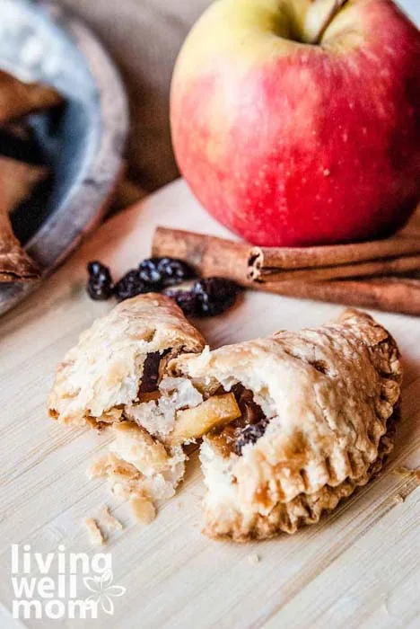 mini apple pie split in half showing apple filling