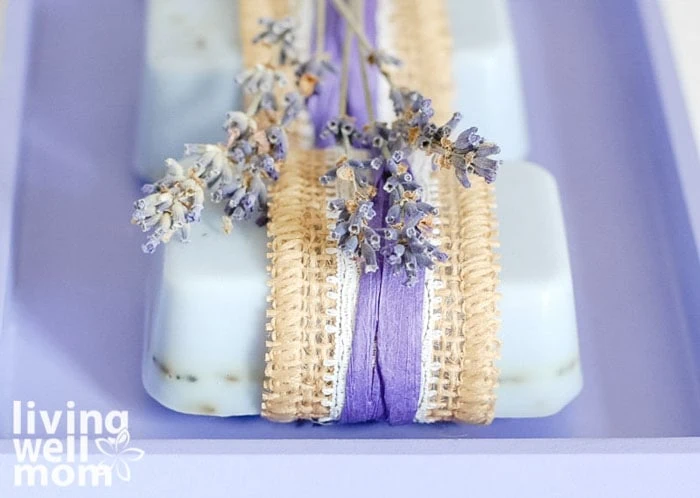 close up of beautiful lavender soaps with dried lavender laid on top
