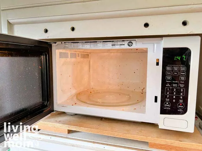dirty microwave with the door open