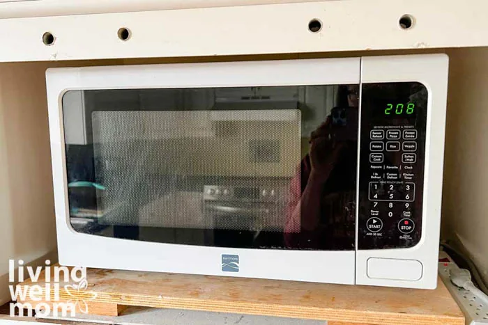 a microwave oven on a wooden counter