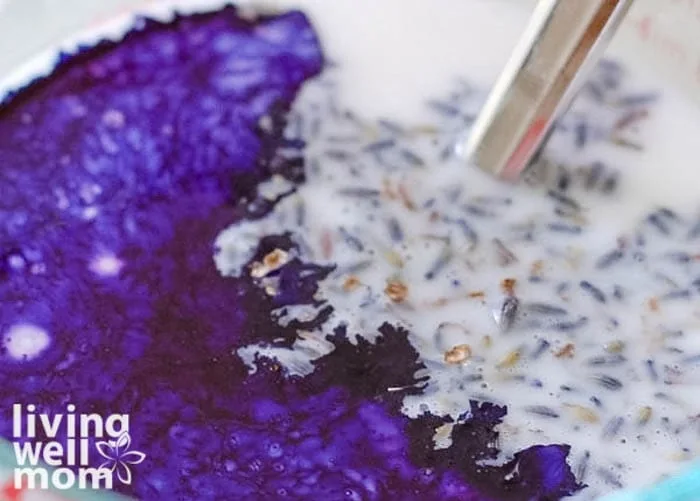 soap base with food coloring and dried lavender before mixing