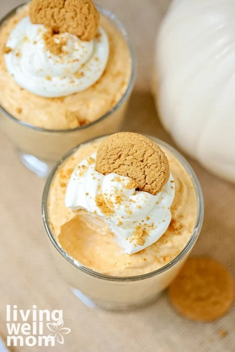 cups of pumpkin mousse with a bite taken out