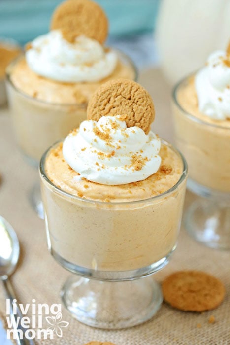 spiced pumpkin mousse topped with whipped cream and a gingersnap