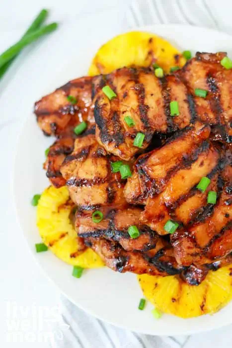 grilled meat on a bed of pineapple slices