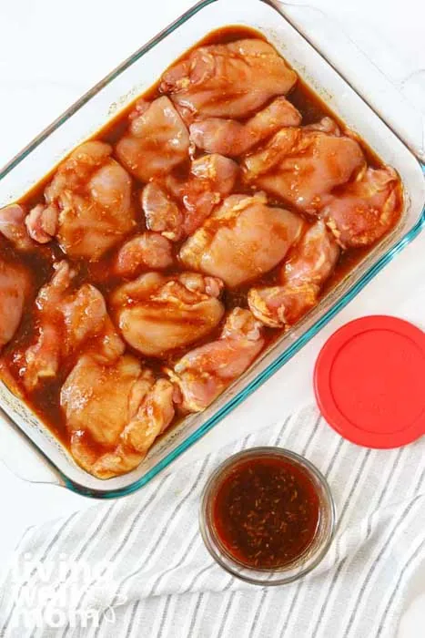 marinating chicken thighs in a baking dish