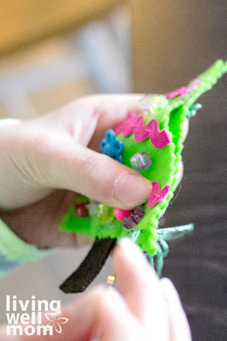 kid sewing DIY felt ornaments