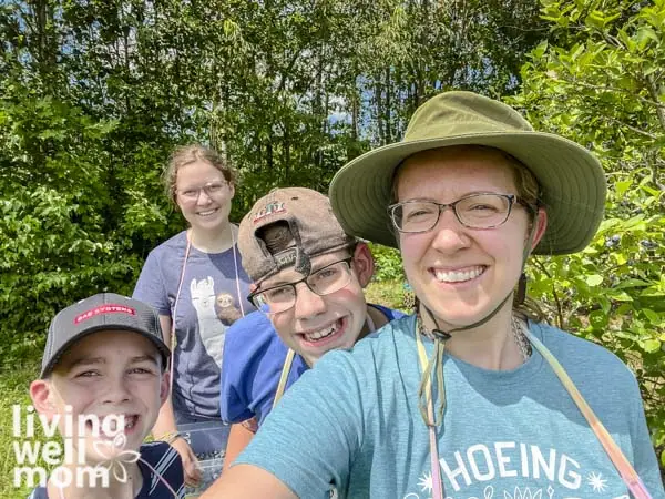 mom and kids out picking berries