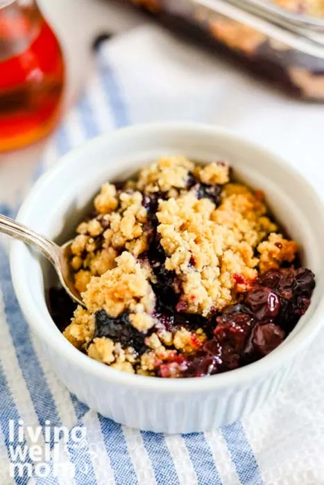 taking a bite of blueberry dessert