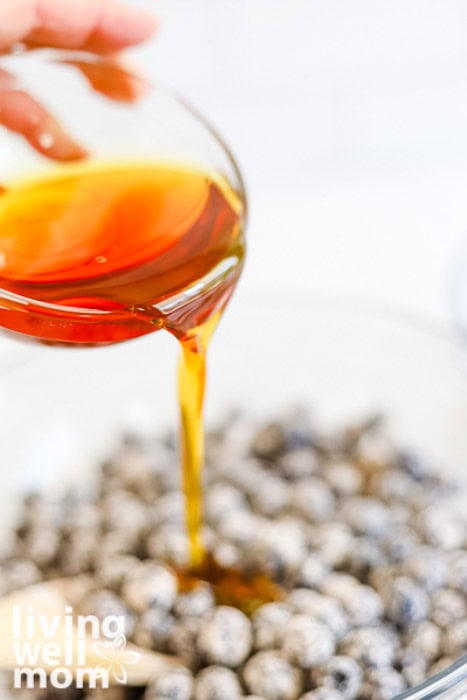 pouring maple syrup from a bowl