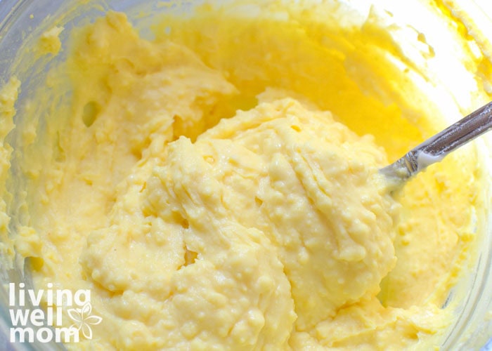 creamy egg yolk filling being spooned up