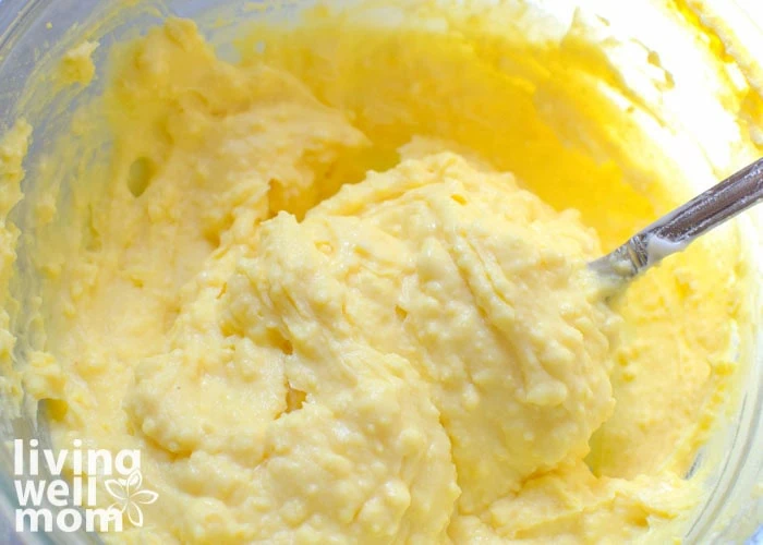 creamy egg yolk filling being spooned up