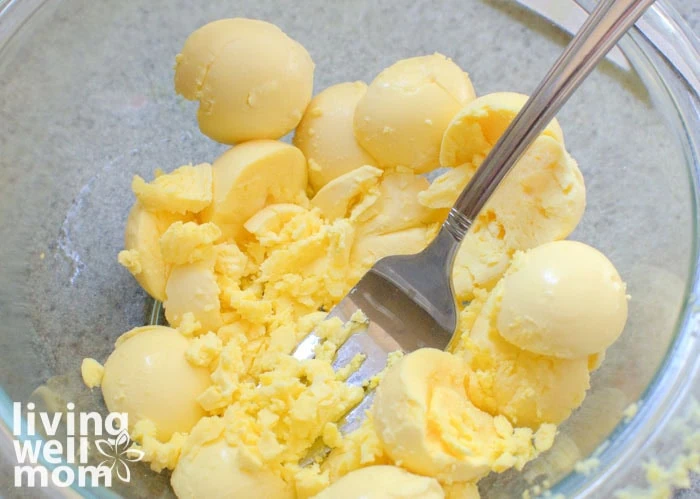 mashing yolks with a fork