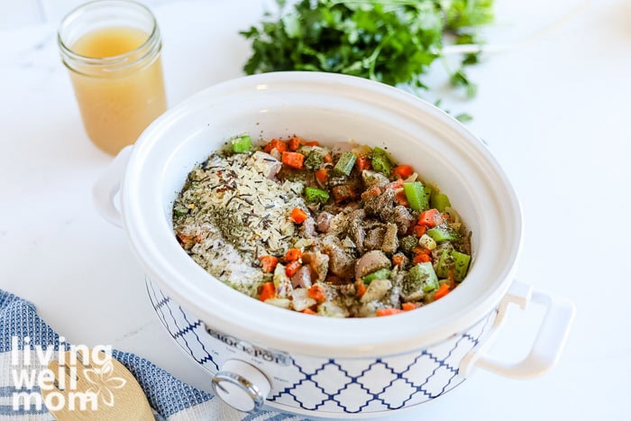 Chicken and veggies cooking in a crockpot