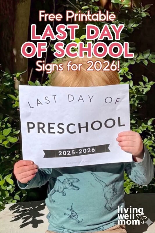 Toddler holding a last day of preschool sign 