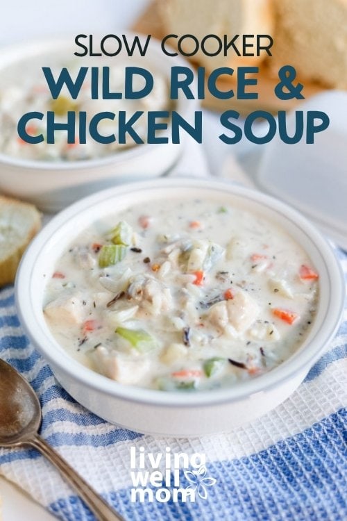 A bowl of creamy chicken and wild rice soup served with warm bread