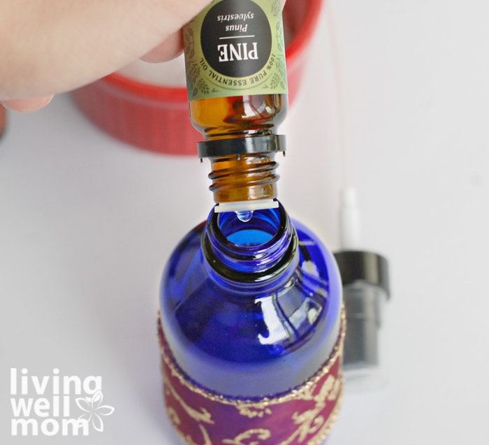 adding pine oil to a glass spray bottle