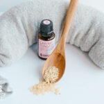 DIY rice heating pad with bottle of lavender oil