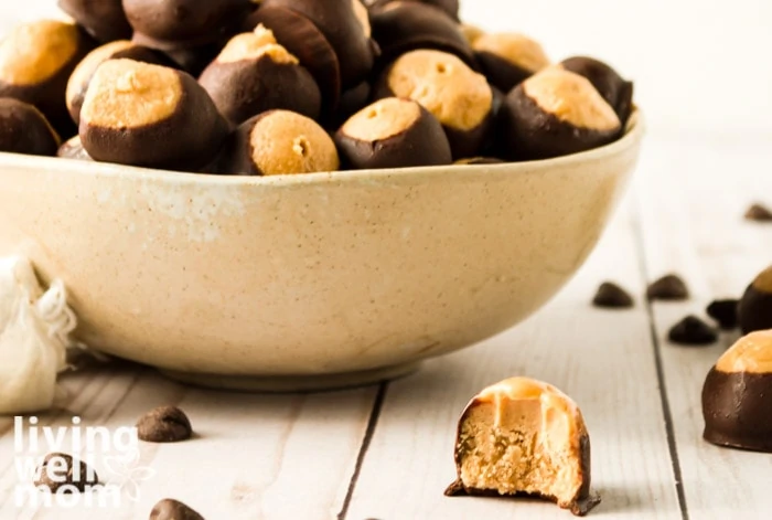 Bowl full of buckeyes with one bitten into