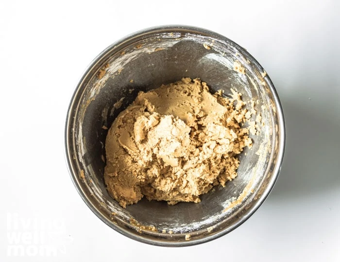 bowl of buckeye dough with peanut butter and sugar