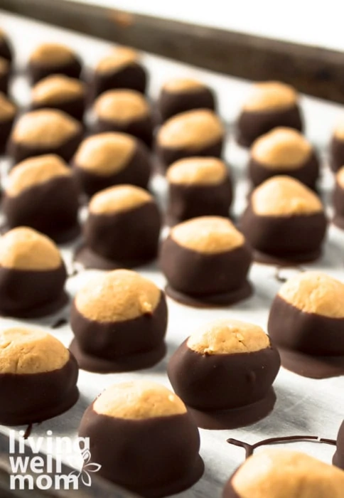 Buckeyes resting on a baking sheet