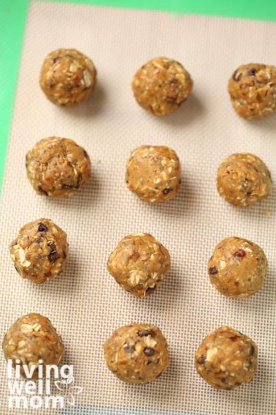 Rolled energy balls on a baking sheet