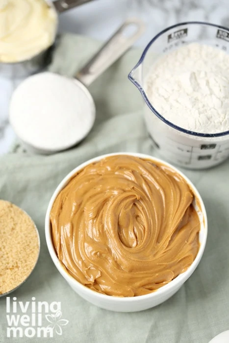 Ingredients for gluten free peanut butter such as sugar, peanut butter, and flour.