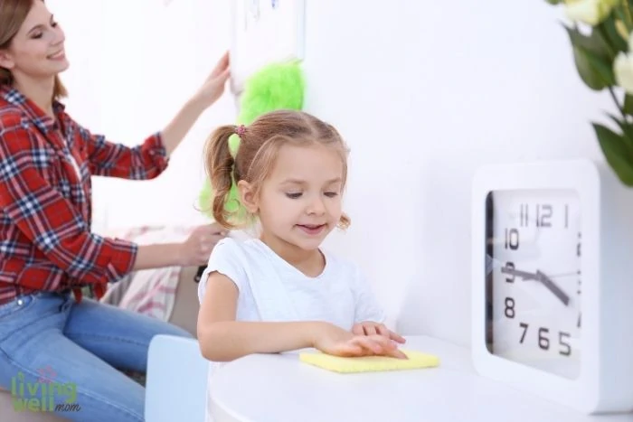 daughter helping mother clean up