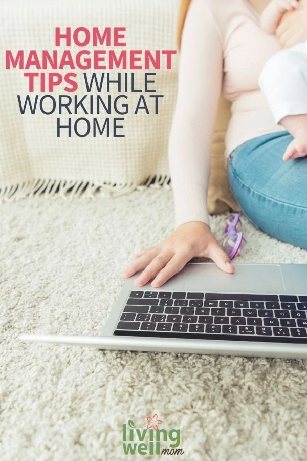 woman working on computer with a baby on her lap