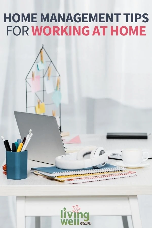 white home office desks with spiral notebooks, laptop and headphones