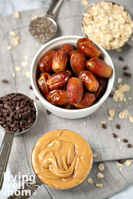 Ingredients for peanut butter energy balls - dates, chocolate chips, peanut butter, oatmeal