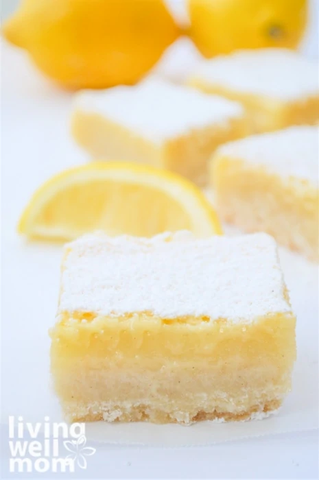 Thick lemon bar with powdered sugar on top.