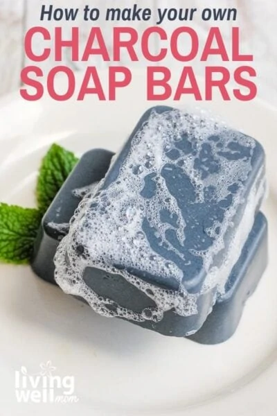 sudsy charcoal soap bars on a white plate with mint leaves