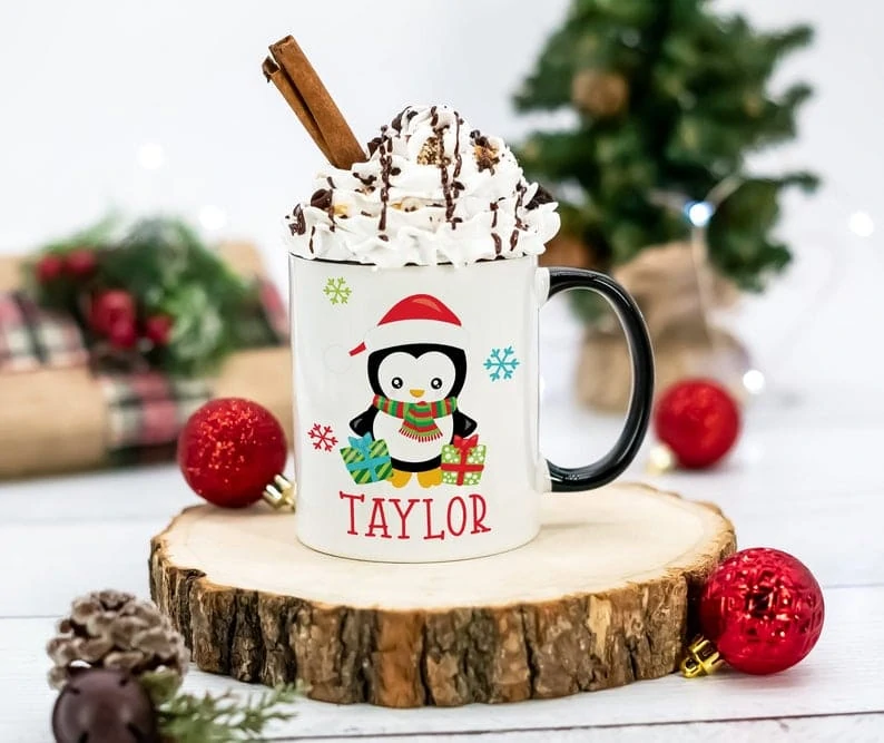 hot cocoa with whipped cream in a penguin mug