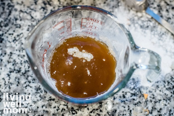 beef broth with tapioca starch in a measuring cup