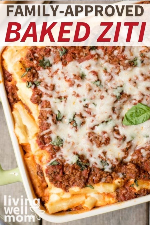 Baked ziti with ricotta in a baking dish topped with fresh basil